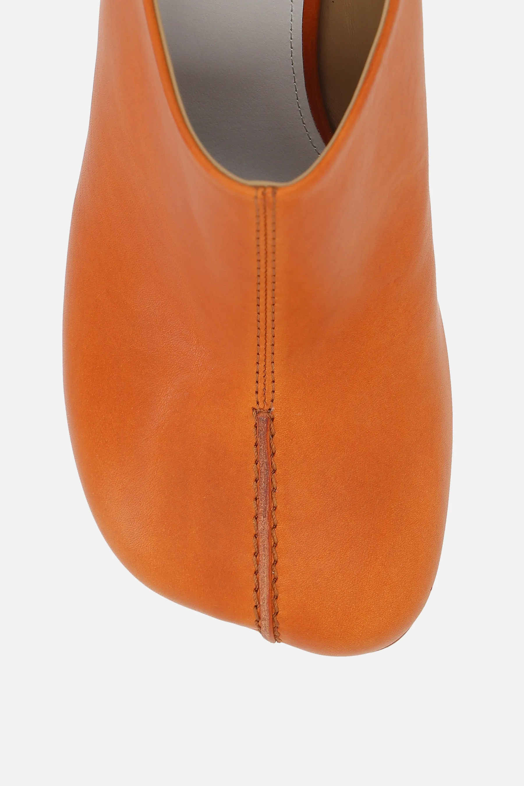 mule in stitch-out leather