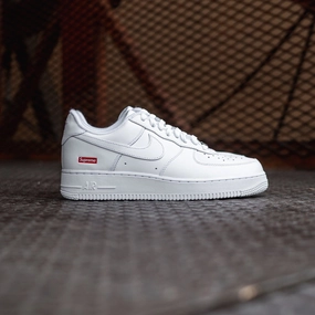 Nike x Supreme Air Force 1 Low SP (White) Nike athletic sneakers with iconic swoosh