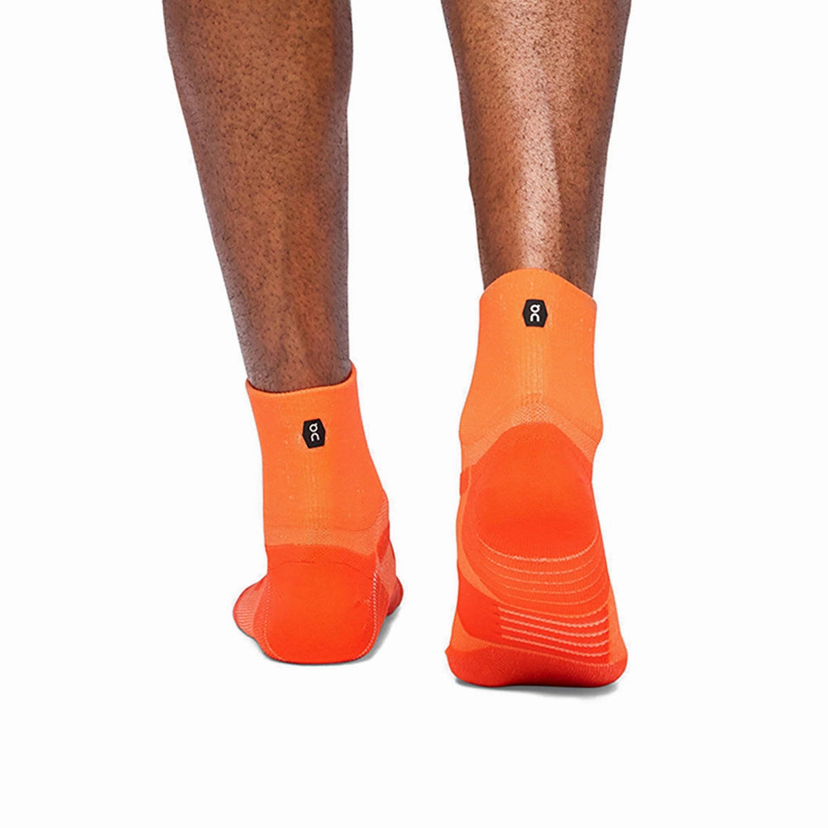 ON Performance Mid Sock Flame Spice On running shoe close-ups