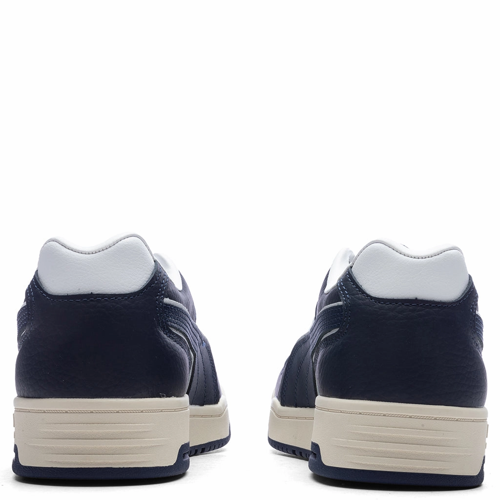 Slipstream Lo Vintage - White/New Navy Puma Suede Street Sneakers