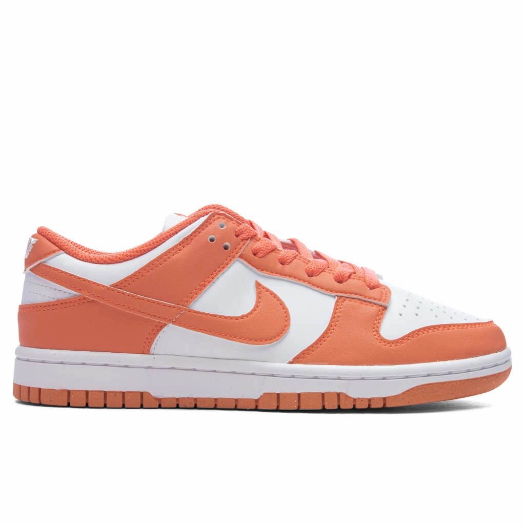 Women's Dunk Low - White/Light Wild Mango Nike fashion sneakers with bold branding